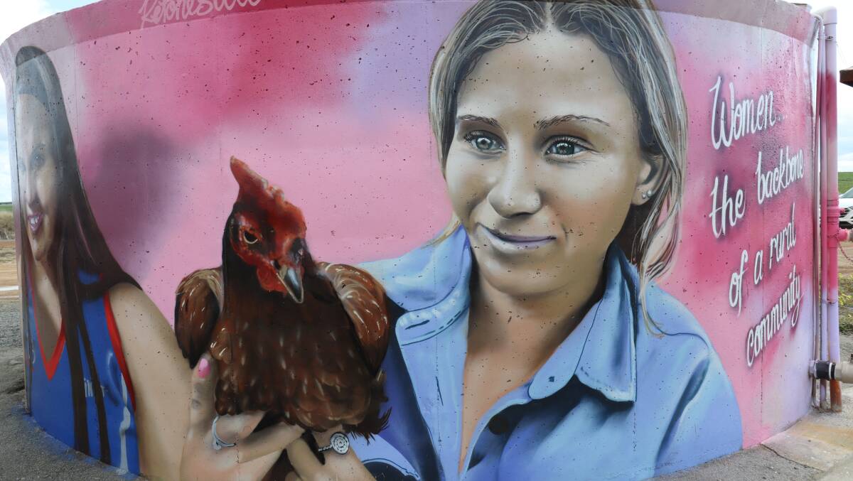 The tank mural shares the message that women are the backbone of a rural community. Despite being known as the chook lady, 19-year-old Blair Hinkley's passion is sheep.