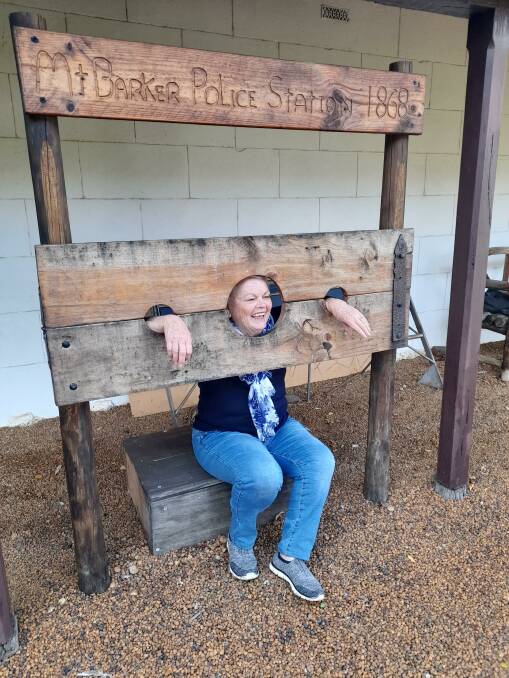 Australind tourist Jennifer Billingham having a bit of fun at the Mt Barker Police Station & Folk Museum.