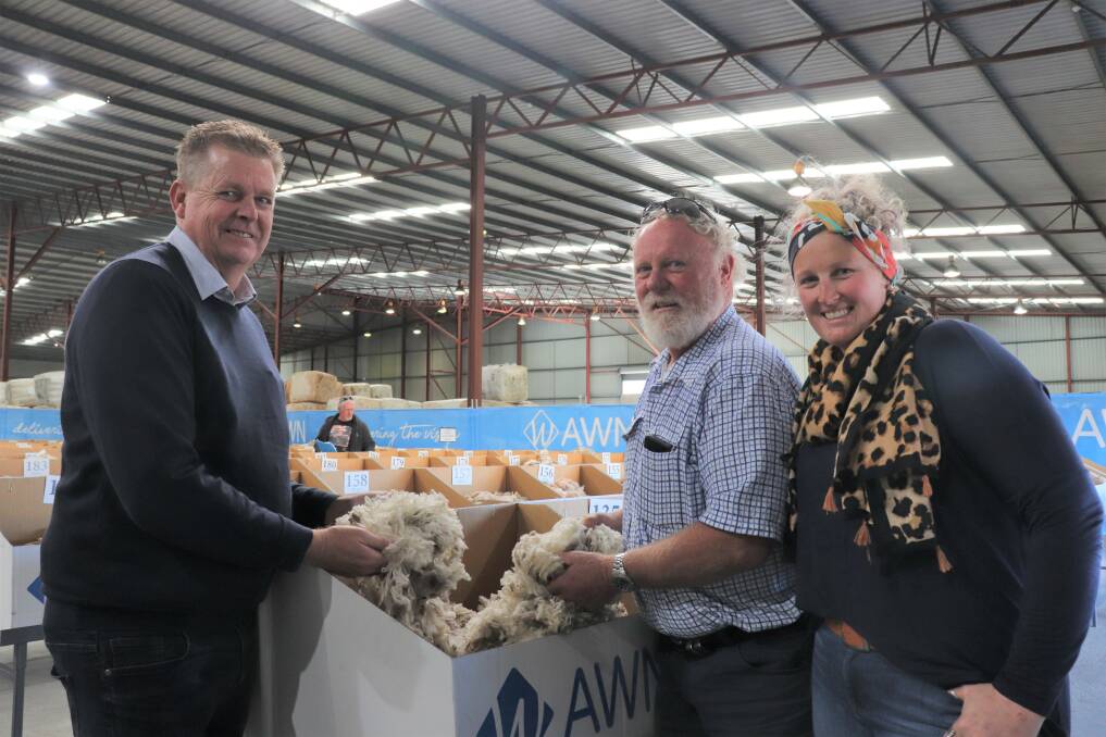 Woolgrowers Ken (centre) and Amy Schlueter ventured from Tambellup to visit the Australian Wool Network (AWN) wool stores at Bibra Lake to see their wool before the sale, with AWN wool broker Steve Squire.
