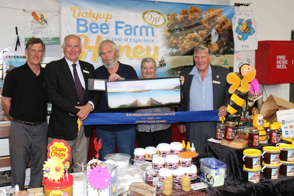 The best indoor trade exhibit was awarded to Dalyup Bee Farm owners Lawrence (centre) and Janis Beilken with Esperance and Districts Agricultural Society (EDAS) vice-president David Pengilly (left) and judges, chairman of Agricultural Shows Australia Rob Wilson and EDAS president Graham Cooper, Esperance.