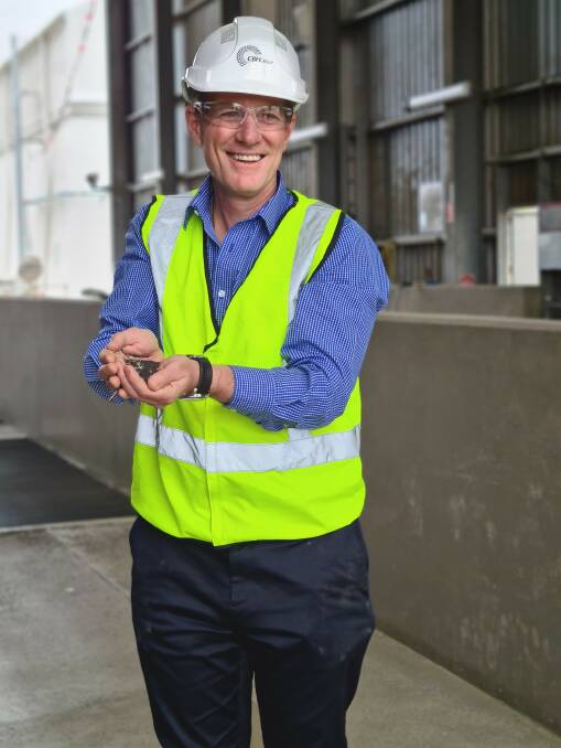CBH Group chief marketing and trading officer Jason Craig with a handful of canola at the CBH grain terminal at Kwinana.