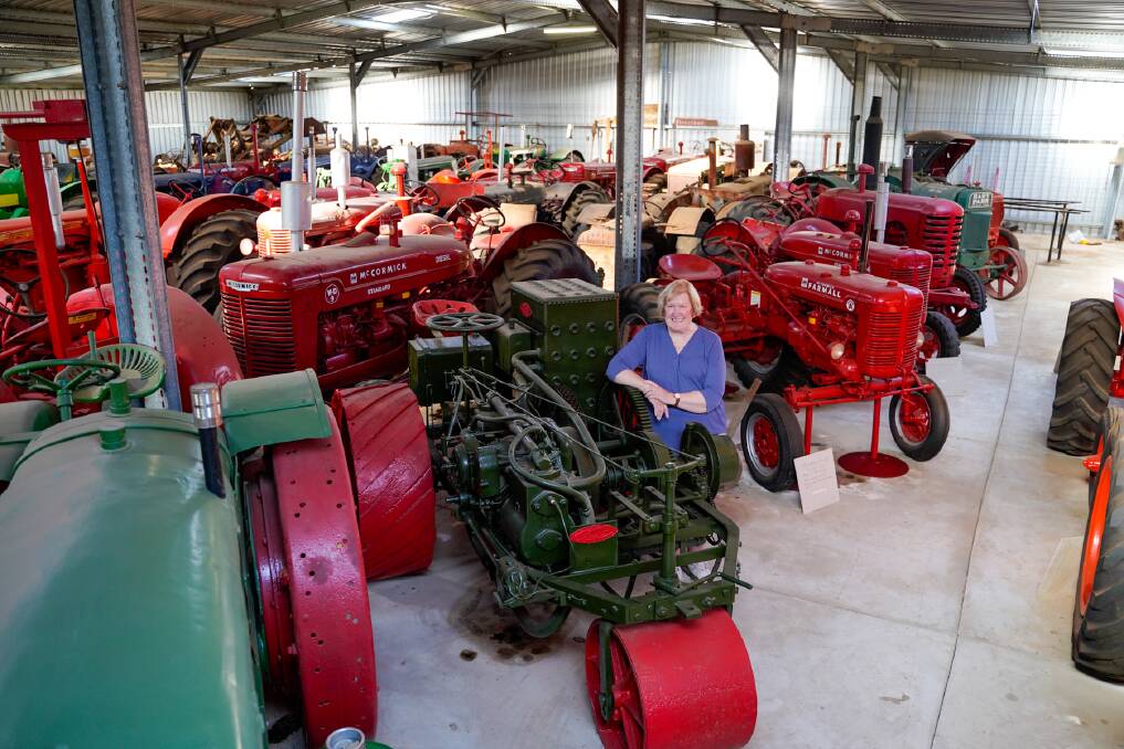 Sue Illingsworth with the 1904 Ivel Agricultural Motor and some of the other 149 tractors she and her husband collected over more than 50 years at their cropping and sheep property at Arrina. Pictures by Donington Auctions.