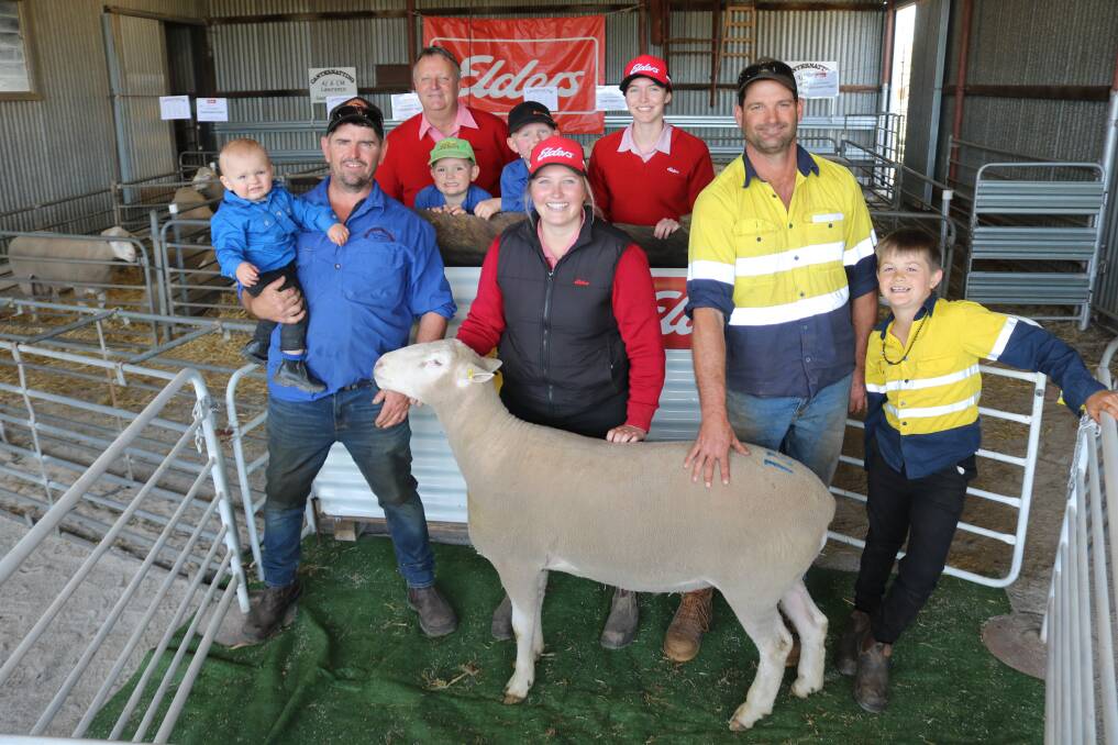 At the Canternatting Poll Dorset studs sixth annual onfarm sale last week was (L-R) Canternatting stud co-principal Nathan Lawrence, holding son Marley, 1, Elders auctioneer Roger Fris, Mack Lawrence, 5, brother Veejay Lawrence, 8, Elders district wool manager Breanna Hayes, Elders work experience student Chloe Venz, Murdoch University ag science, top-priced buyer Scott McPherson and son Jye, Jennacubbine, with the $1500 top-priced Canternatting Poll Dorset stud ram.