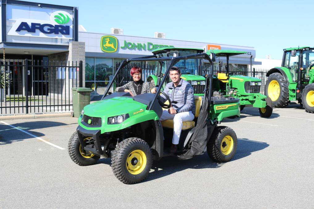 Farm Weekly business development and sales manager Wendy Gould and AFGRI Equipment marketing and small ag manager Jacques Coetzee at AFGRI Equipment's Guildford branch with a John Deere Gator. A similar Gator will be given away as the prize on offer in the Farm Weekly/AFGRI Equipment WIN a Gator Competition which began last week.