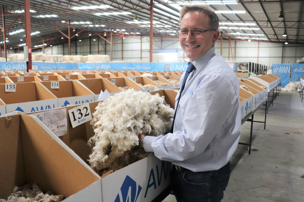 AWN State wool manager Greg Tilbrook with the showfloor sample of Neville and Kaye Dalton's 14.1 Superfine Merino wool that sold for 3600c/kg greasy, the highest price at the Western Wool Centre for 10 years.