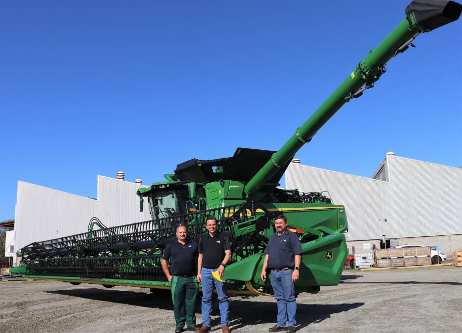 AFGRI Equipment group service manager Charles van Loggerenberg (centre) and technical advisers Gert Grobler (left) and Riaan Ferreira with the just arrived John Deere X9 1100 Signature Edition combine harvester, the first Class 11 combine in Western Australia.