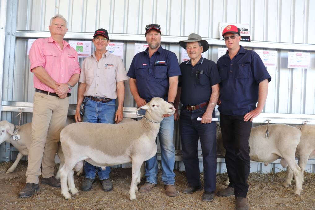 Blackwood SheepMaster stud's $3100 top-priced ram with Elders Livestock's Geoff Shipp (left), Blackwood co-principals Martin Bleechmore and Phil Corker (holding ram) and buyers Steve and Murray Magini, S & MD Magini, Mokup.