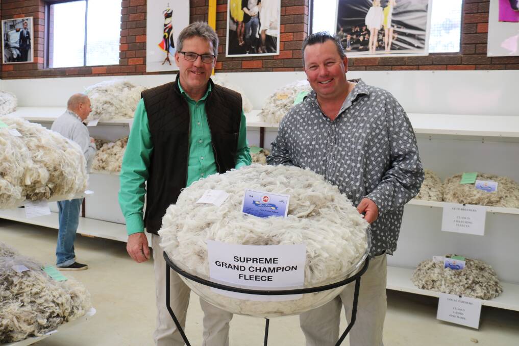 Wool section steward and Nutrien Ag Solutions wool account manager Andy Beaton (left), Esperance, congratulated Geoff Thomason, Two Rivers Estate, Coomalbidgup, on winning supreme grand champion fleece.