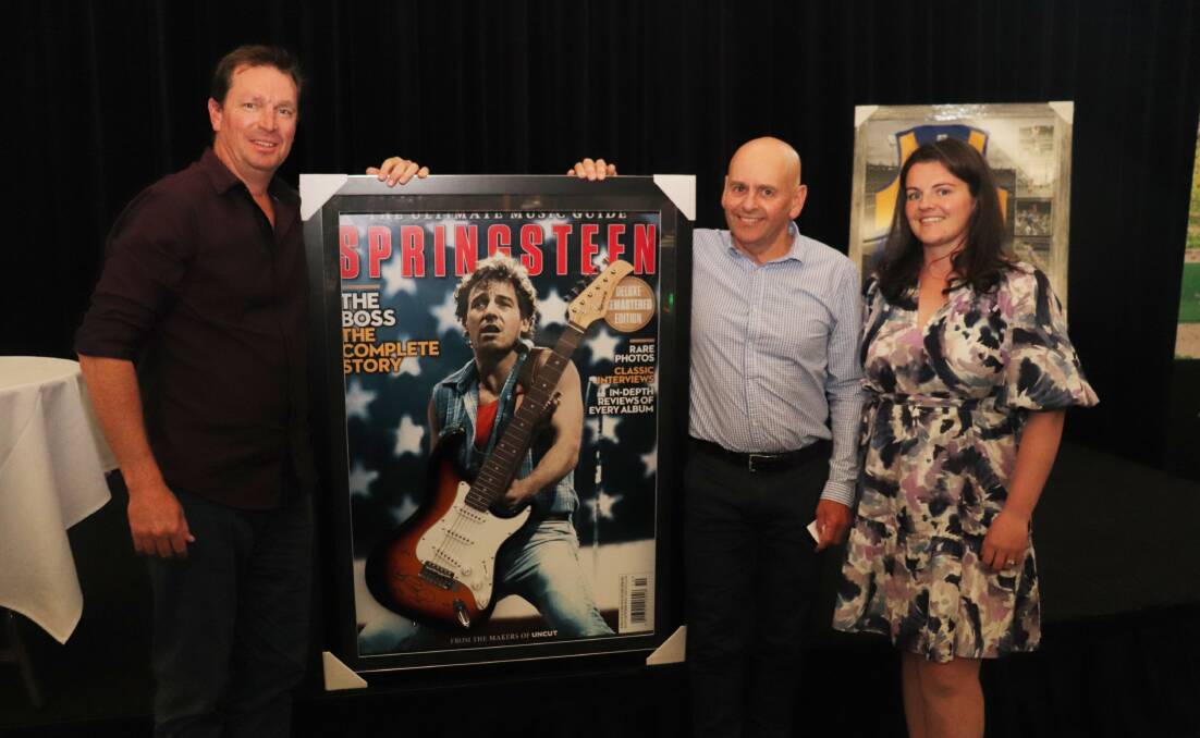 Nutrien Ag Solutions retail fertiliser manager, Fremantle, Stuart Gray (left), with Arkle Farms chief executive officer Greg Kirk, who won this Bruce Springsteen guitar and Dalwallinu farmer Leanne Sawyer.