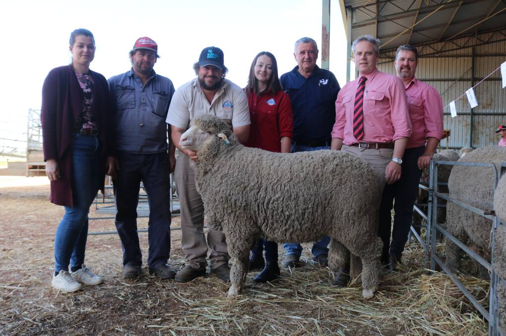  Seymour Park studs Dee (left), Sheldon, Clinton and Sarah Blight, Highbury, top price ram buyer Bill Cowan, Crichtonvale Merino and Poll stud, Narembeen, Elders area manager central, Matt Beckett and Elders stud stock specialist, Nathan King, with the $20,000 top-priced ram at the sale.