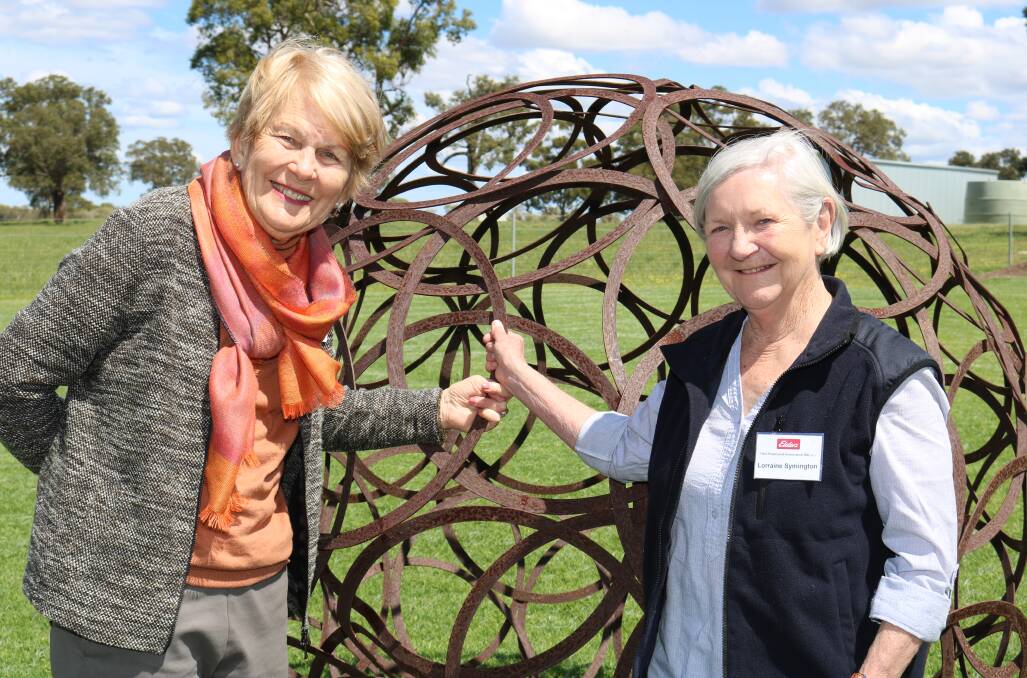 Glenys Moulton (left), Subiaco and EPEA committee member Lorraine Symington, Willetton, with one of the artworks in the garden at Warringah farm.