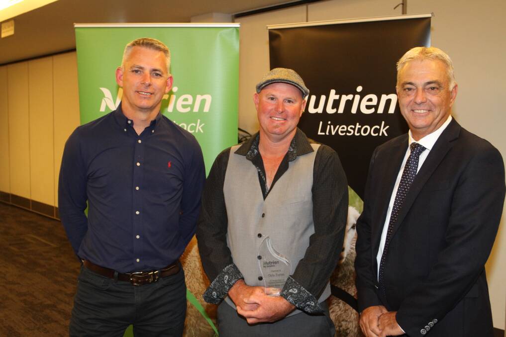 Mr Clayton (left), presented Pingelly/Brookton agent Chris Turton with a recognition award for his sheep transactions in the past year alongside Mr Giglia.