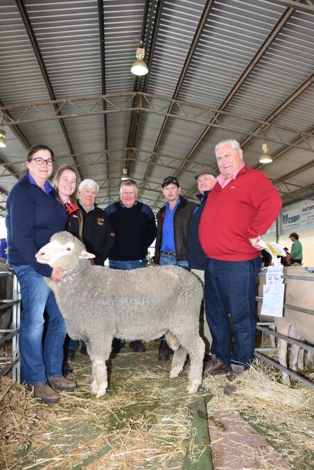 In the offering of rams from the Auburn Valley stud, Williams, prices hit a high of $2500 for this Poll Merino ram. With the ram were Auburn Valleys Brooke Rintoul (left), Elders stud stock representative Lauren Rayner, Auburn Valley principals Peter and Jeffrey Rintoul, buyers Paul and Bob Treasure, Wandering and Elders stud stock representative and Auburn Valley classer Kevin Broad.
