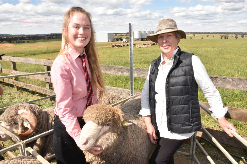 Elders stud stock representative Lauren Rayner (left), holds the $4100 second top-priced ram at the Rangeview on-property sale at Darkan last week purchased by commercial producer Kieran Power, McAlinden. With her is Rangeview stud connection Geraldine King.
