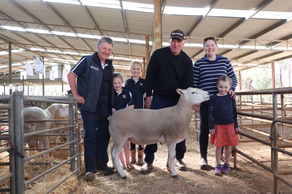 Jim Jan Texel studs, Jan Glover with granddaughters, Josie, 6, and Ella, 8, Robinson, Jim Glover and buyer Ellen Walker with daughter Piper de Gruchy, 5, and the $3400 top-priced Texel ram.