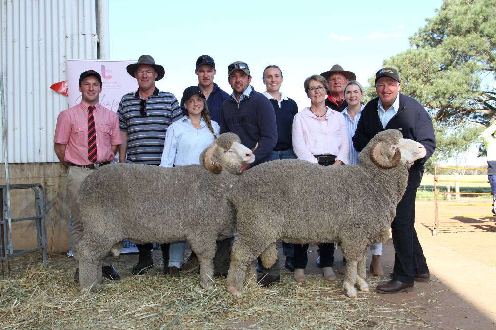 The top-priced Merino ram for the season was sold by the Dewar familys Woodyarrup stud, Broomehill, Kojonup, when they sold this two-tooth sire at the studs on-property sale for $13,500 to the Doyle family, Wylivere Farms, Corrigin, who purchased three Merino rams in total at the sale. With the $13,500 ram (left) and one of the other rams the family purchased at $7500 were Elders auctioneer and Gnowangerup representative James Culleton (left), buyers Greg and Ben Doyle, Wylivere Farms, Woodyarrups Minou Runkel, Lachlan Dewar, Sandra Gianoli, Isabella and Craig Dewar, Woodyarrup stud co-classer Russell McKay (rear right), Elders stud stock and his daughter Abby (to his right).
