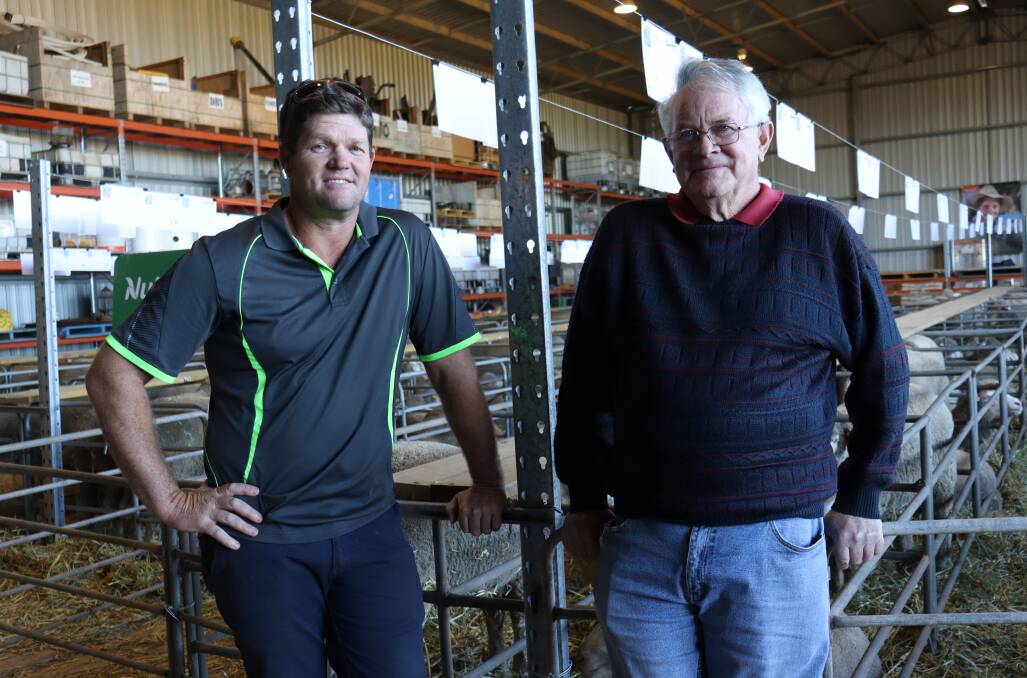 Wade Brockway (left) and father Greg, Wagin, purchased seven Chirniminup Dohnes rams at Monday's sale to enter the "100 club".