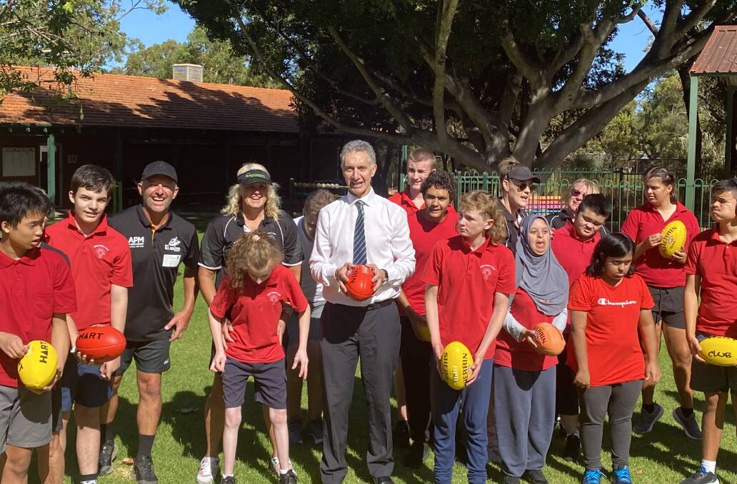 Mr Buti playing footy with students at the All Abilities kickability sports event at Gladys Newton School, Balga. Mr Buti said his aim as Education Minister is that "I want every student who goes to school to reach their full potential, whatever that may be".