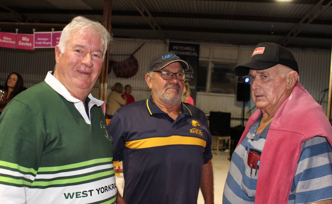 Trevor Ryan (left) and event co-cordinator Quentin Davies, Yorkrakine, with Elders Wyalkatchem wool and livestock agent Russell Wood at the Shearing For Liz Pink Day on Saturday which raised more than $100,000 for Breast Cancer Research Centre - WA.