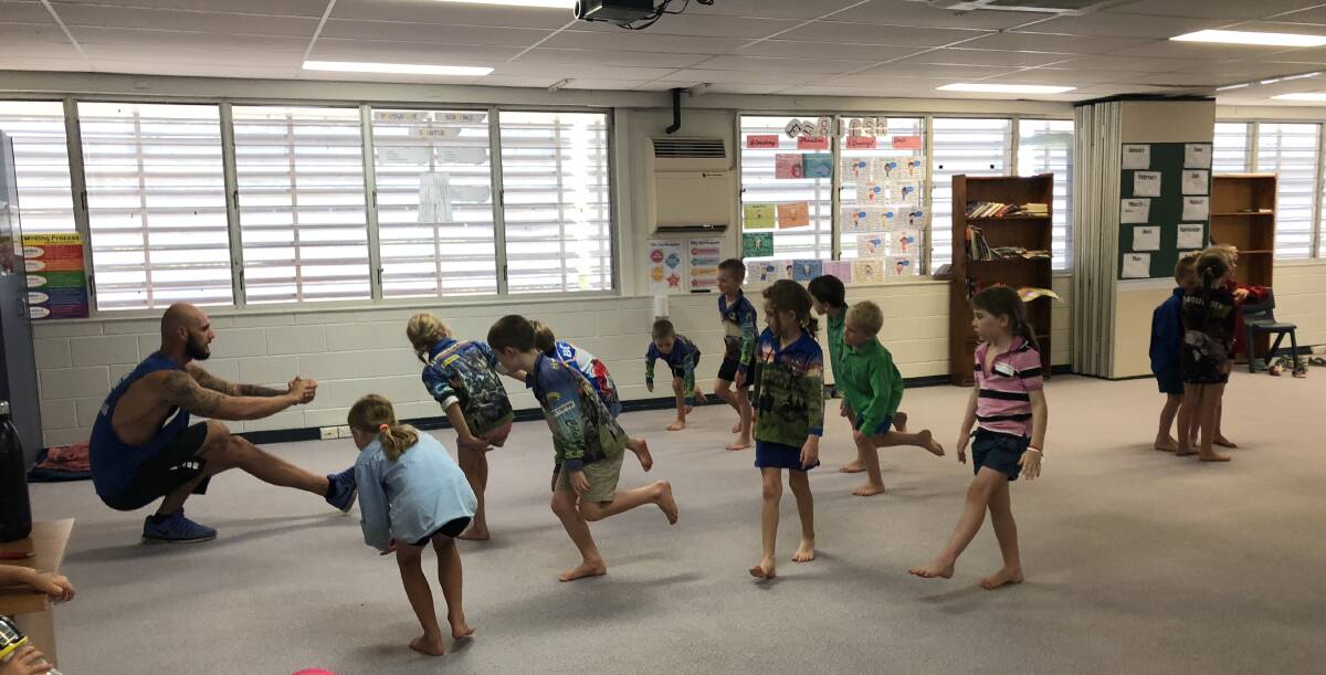 The kids hone in on their balance and concentration skills during yoga class.