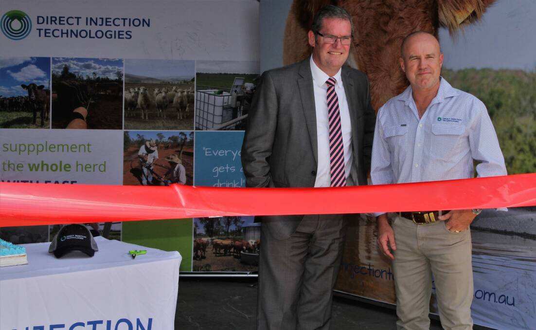Member for Groom, John McVeigh, and Direct Injection Technologies founder, Mark Peart, ready to cut the ribbon for the new Toowoomba warehouse.