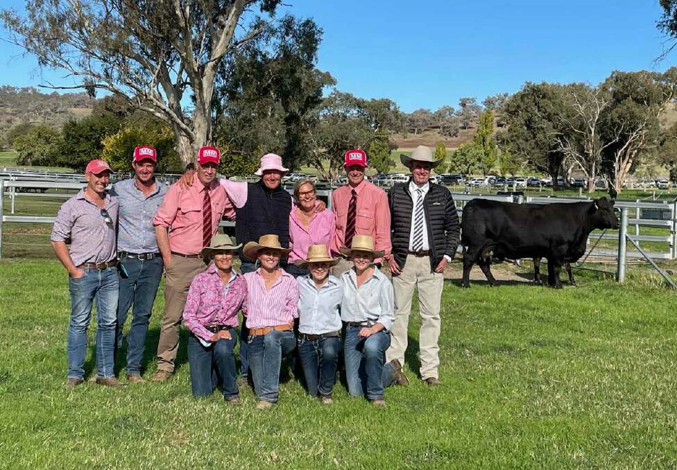 The Millah Murrah Angus crew celebrating the sale of Flower N30, for the sale top of $140,000. The cow was purchased by Edengate, Eastbrook, via Elders Manjimup, Western Australia. Photo Karen Bailey