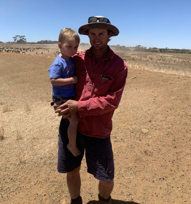 Andrew Scanlon (pictured with his son, Henry) benchmarks his wool and farming operations and says Merinos are still the best performing sheep breed. 