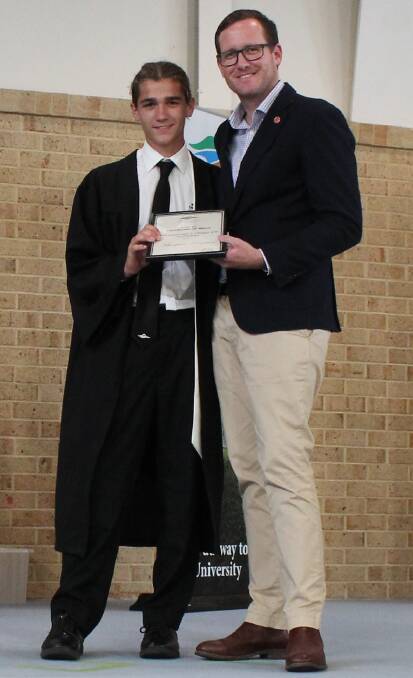 Thomas Dimasi (Northam) received the award for most consistent in Design and Technology from Agricultural Region MP Martin Aldridge at the valedictory ceremony.