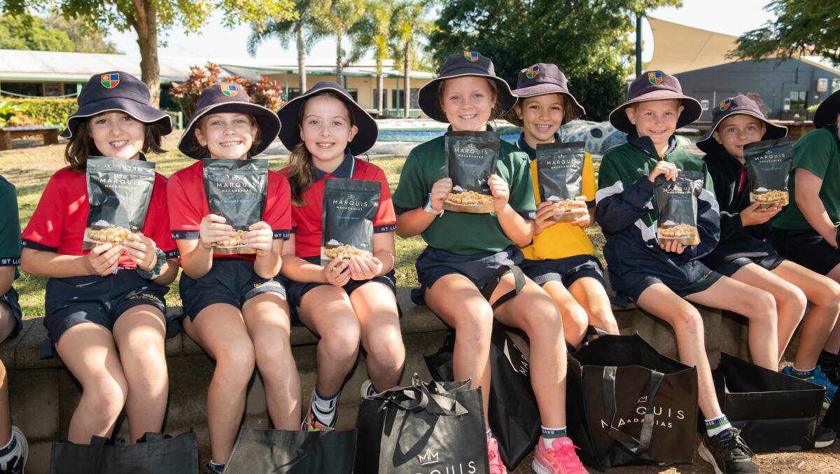 HEALTHY: Some of the St Luke's Anglican School students ready to enjoy some macadamia nuts. 