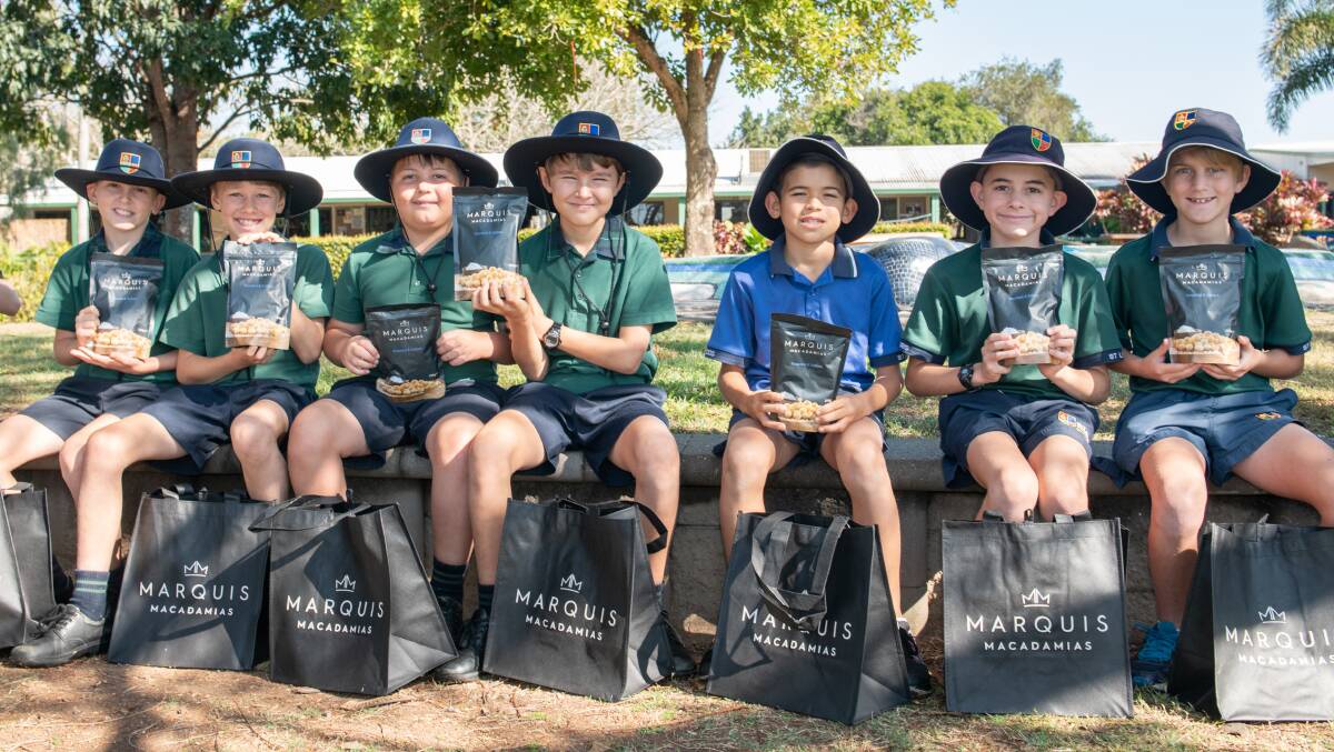 SNACK TIME: St Luke's Anglican School show off the donated Marquis Macadamias products. 