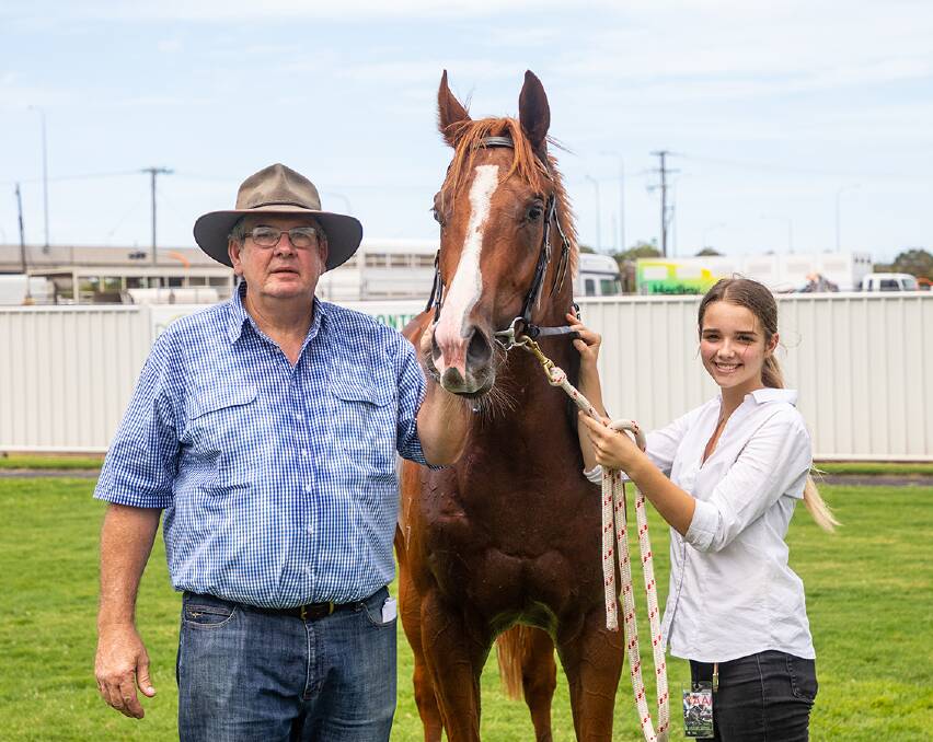 Recent Townsville 2YO winner Clever Hunter with Cairns trainer Trevor Rowe and strapper Charlotte Adams. Rowe has collected $18,800 in QTIS bonuses in January with Clever Hunter providing $17,000 with two wins at Townville. Picture: Mike Mills
