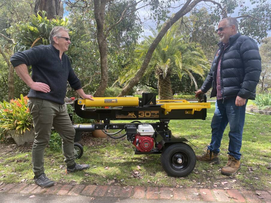 Peter Watson, Kangaroo Ground, Victoria, taking delivery of his Bullmax 30 ton Log Splitter from Bullmax director Eric Grimshaw.