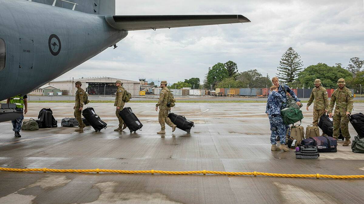 Royal Australian Air Force Aviators board a C-27J Spartan at RAAF Base Amberley, bound for Western Australia. Photo: CPL Brett Sherriff