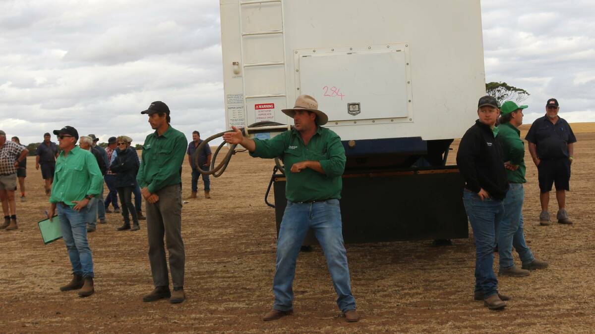 Nutrien auctioneer Jarrad Hubbard in action with one of the most hotly contested items on the day, this Tornado bin.