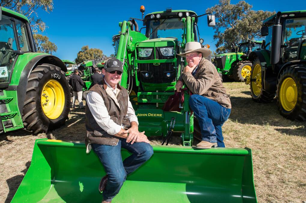 WE'RE WAITING TO HELP: Representatives of most major farm tractor and machinery brands will be on hand at this year's FarmFest to discuss their latest models and technologies with visitors.