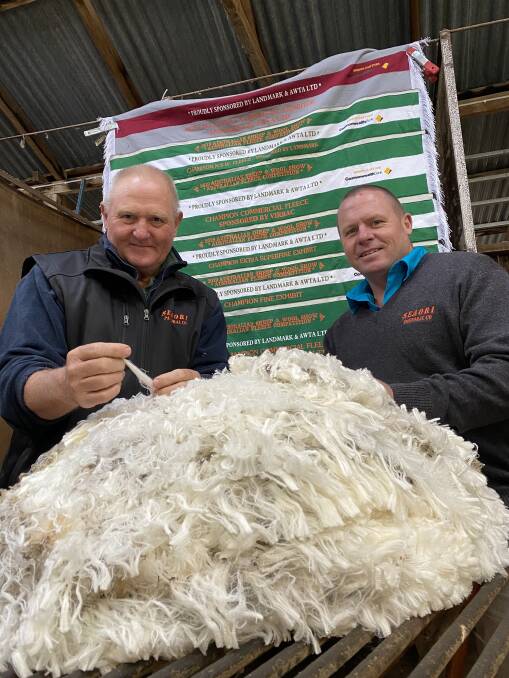 FINE PURSUIT: Paul Seaman, left, with his son Neil. At their Rosemont operation, the main aim is continual improvement of the family's flock. 