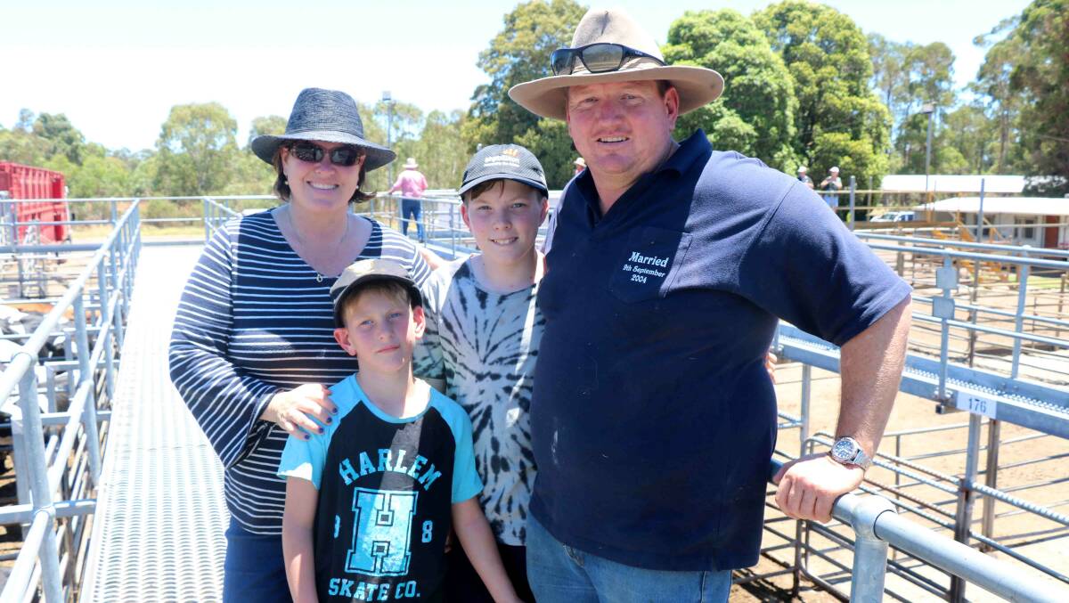Making it a family day out to see their cattle sell to $907 were Kirrily and Wayne Bennet, with children Teal and Macklan, Stratham.
