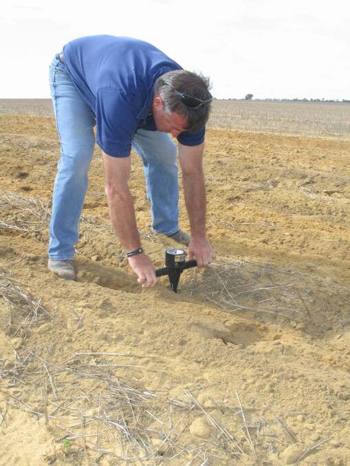 Andrew Messina uses a penetrometer to test subsoil compaction: "By digging deeper more lime can move through the profile to that depth because it's not needed in the top soil, so hopefully it can start to elevate soil pH." 