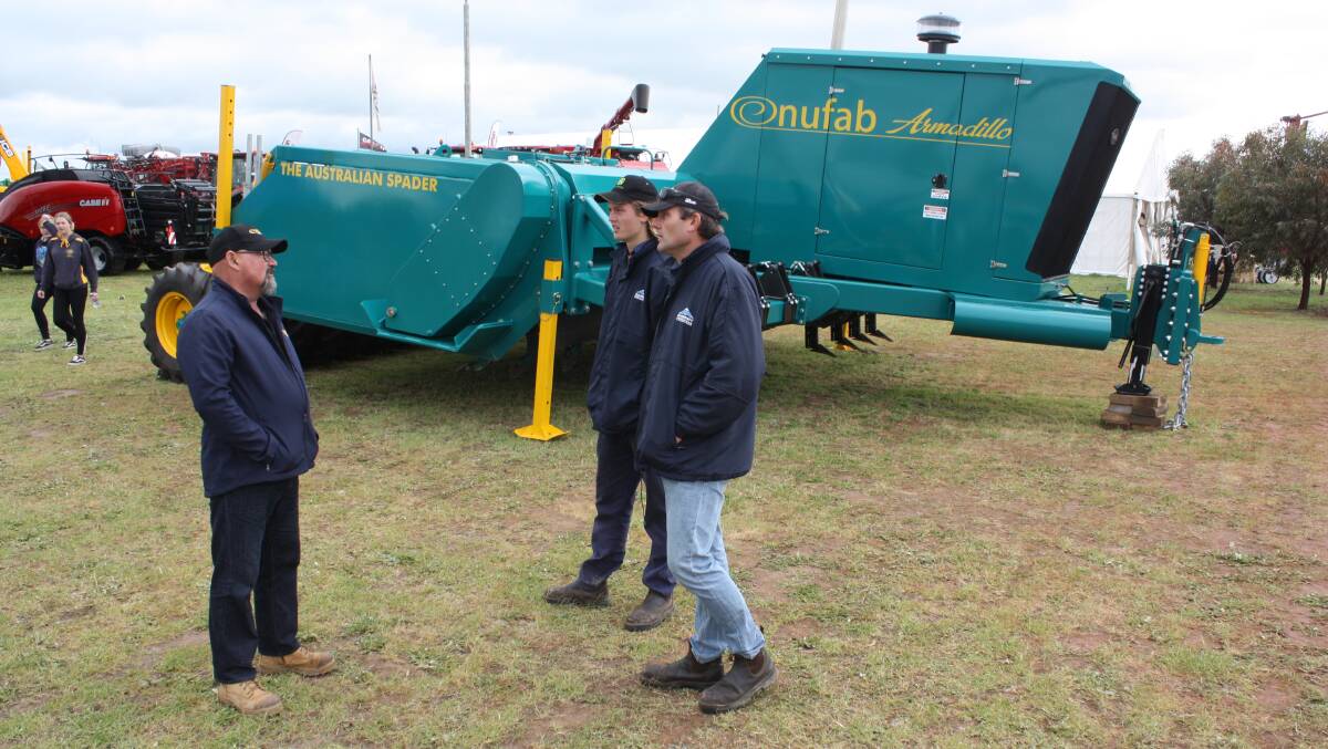 Geraldton manufacturer Nufab Industries created a lot of world-wide publicity with its Armadillo self-propelled spader. Pictured here discussing its features at the Dowerin GWN7 Machinery Field Days were Nufab Industries operations manager Chris Bechard (left) and Goomalling farmers Brady Even and his father John.