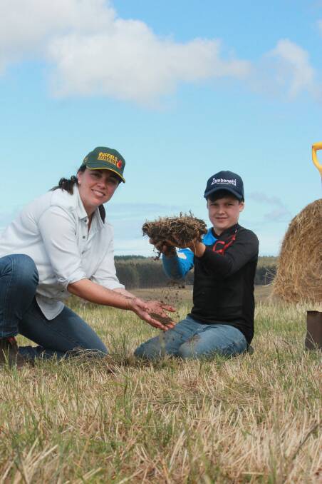 Kalgan and Bremer Bay farmer Johanna Tomlinson and her son Nathan take a closer look at the soil profile on their Kalgan property. Johanna will head off on a Nuffield scholarship tour next year to look at how other agricultural systems may be dealing with soil acidity.