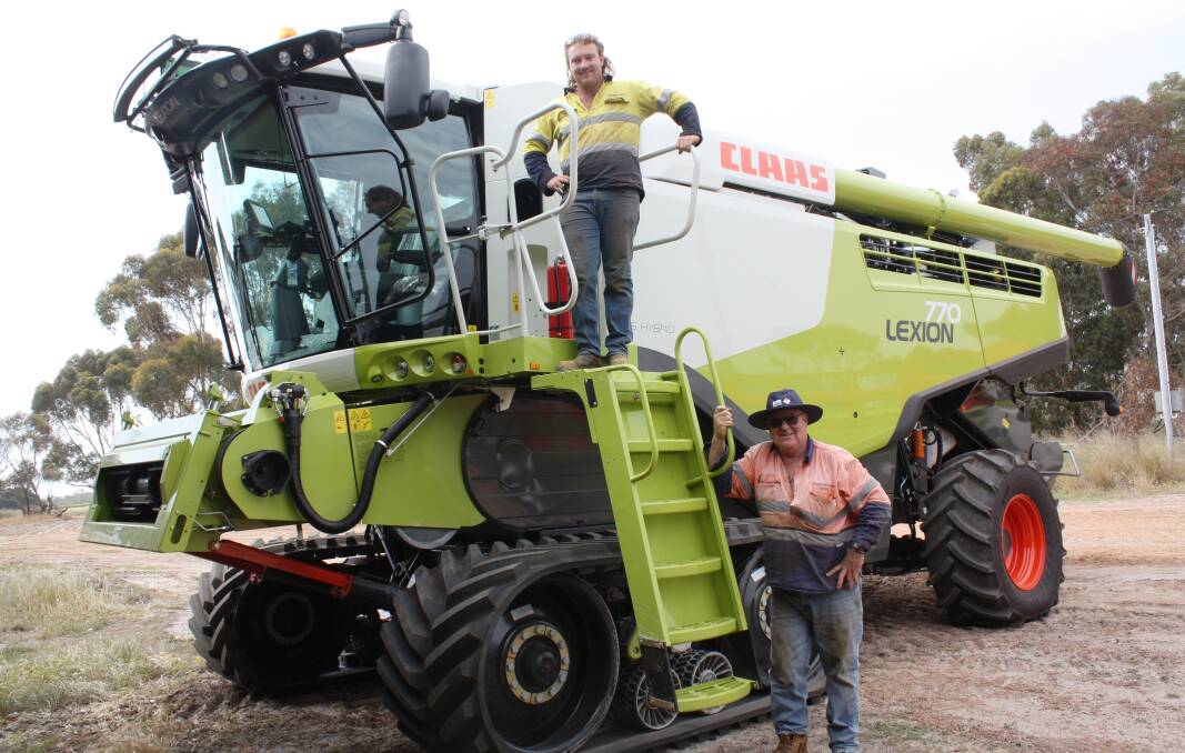 Who gets to drive first? That's the first question that needs to be answered as JJ Wallace (left) and his dad John vie for the driver's seat on their new Lexion 770 header, delivered recently by CLAAS Harvest Centre, Esperance. 