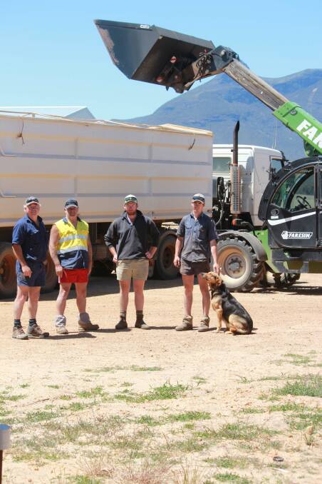 Graham Moir (left), truck driver Laurie Bagnall and Murray and Brenton Moir on their Amelup property loading some of the last grain to go to CBH from last year's harvest.