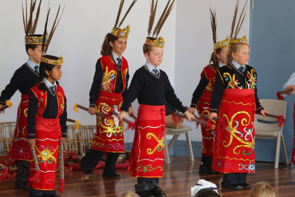Students learn an Indonesian dance in traditional outfits. Image supplied.
