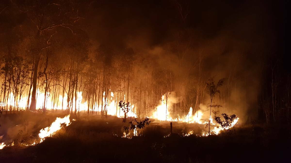 A raging bushfire burns at Deepwater at the height of last year's disaster. 