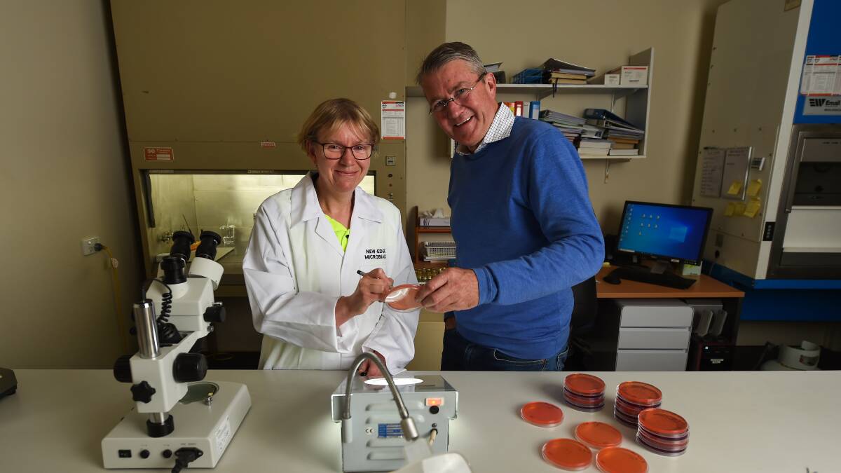 NEM laboratory manager Elissa Barrett in the lab with managing director Ben Barlow. 