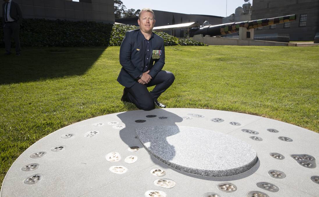 Shaun Ward at the unveiling of a military working dogs memorial at the Australian War Memorial on Monday, where the remains of his former working dog, Aussie, is interred. Picture: Sitthixay Ditthavong 