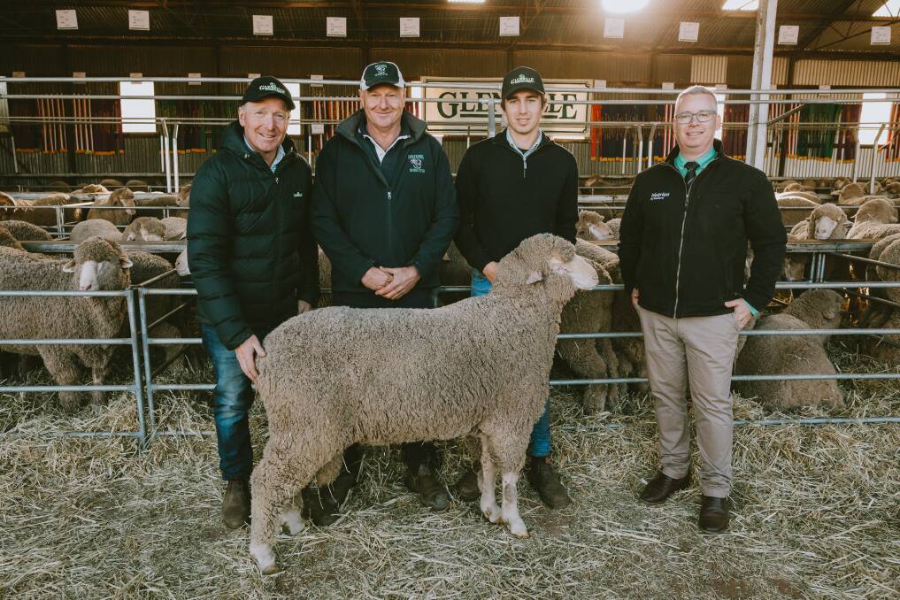 RIGHT SIRE: The 2020 equal top price ram sold to Oak Farms with Daryl Smith, left, Nick Lienert, of Oak Farms, Klay Smith and Nutrien ag auctioneer Gordon Wood. 