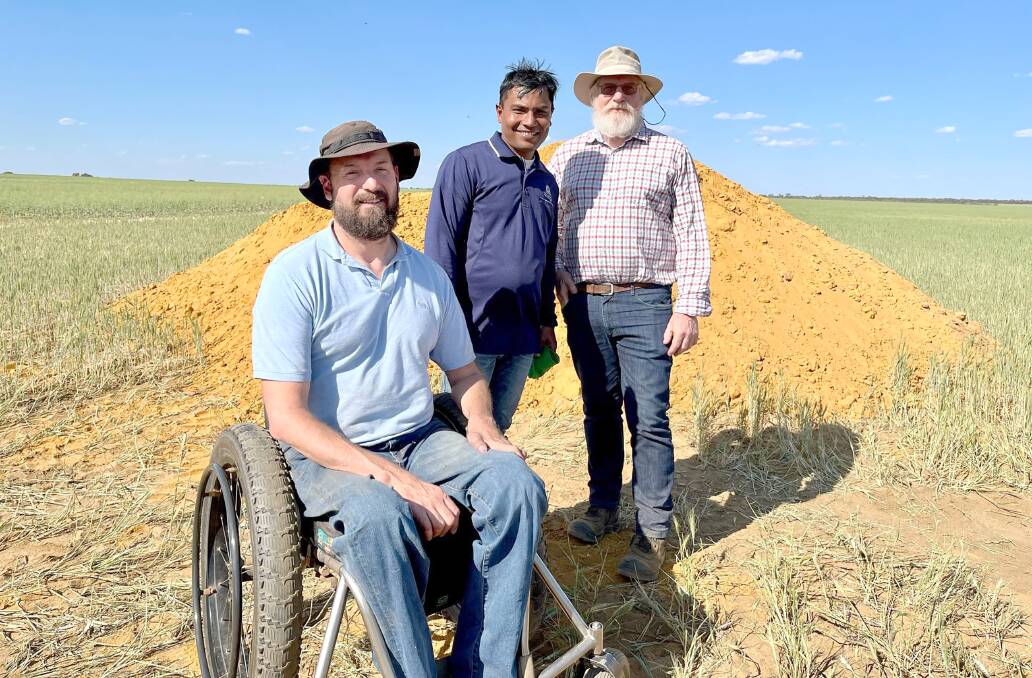 Department of Primary Industry and Regional Development soils researchers Craig Scanlan (left), Gaus Azam and Chris Gazey at a soil reengineering site at Kalannie.

