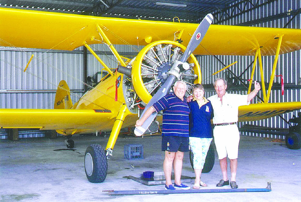 Jack Smart (right), with close friends, captain Ron Eastman and Rons partner Aggie Przybylski, in front of Mr Eastmans United States Boeing-Stearman biplane. Mr Eastman was a past MacRobertson Miller Airlines (MMA) and Ansett Airlines pilot.

