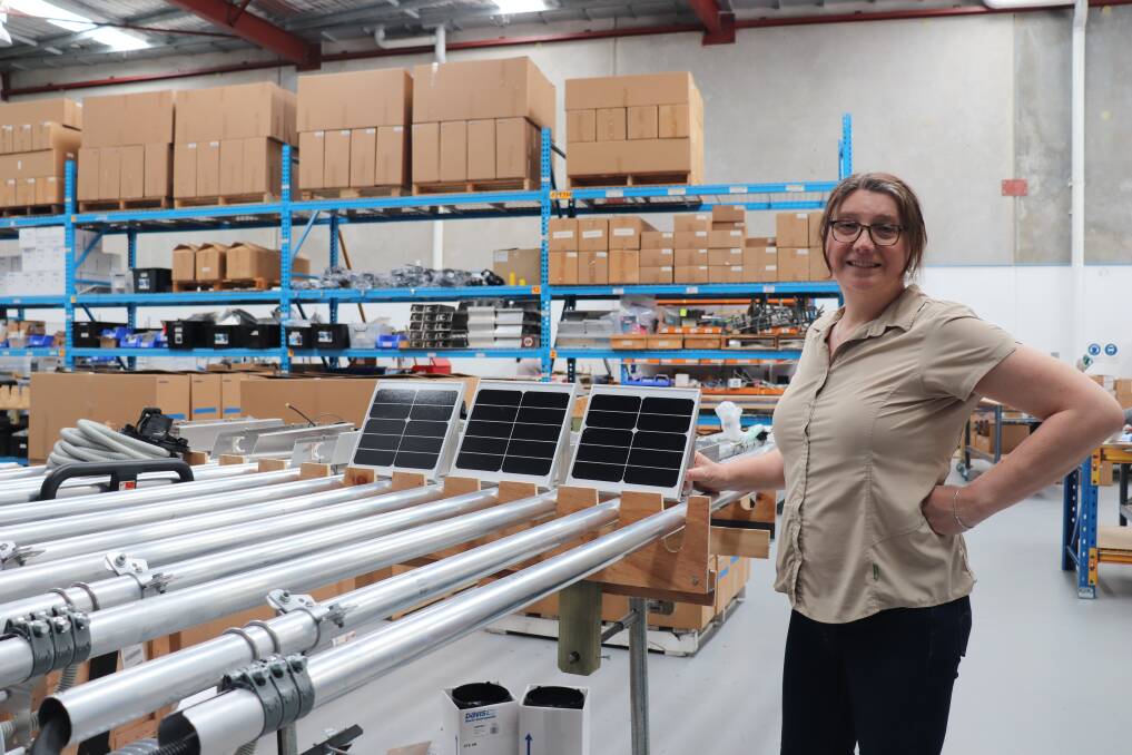 Annie Brox checks the assembly of the comprehensive weather stations produced by Origo.ag.